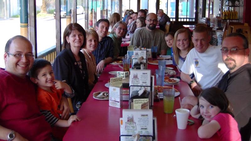 Multiple veteran families eating lunch together